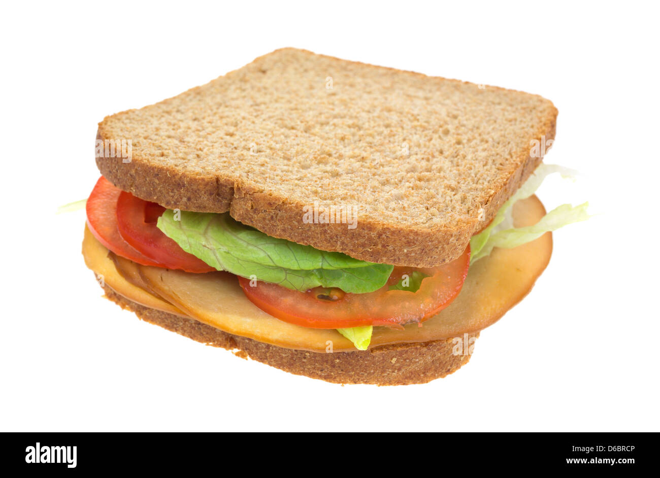Ein Vollkorn-Sandwich mit geräuchertem Tofu Türkei Tomaten und Kopfsalat. Stockfoto
