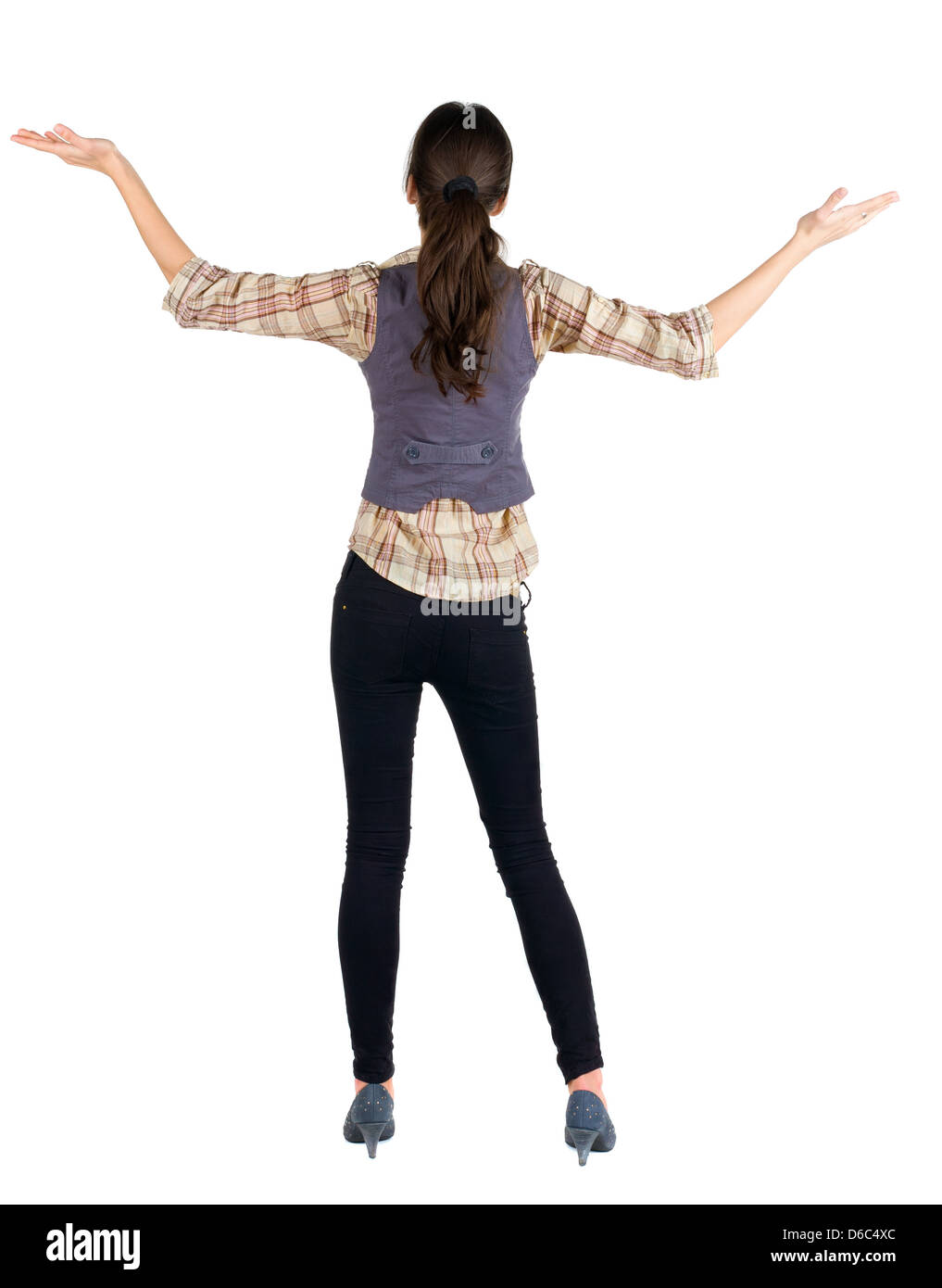 Rückansicht des schönen Brünette Frau in Jeans und Shirt. Vorführung von positiven Emotionen. Hintere Ansicht Menschen Sammlung. Rückseite Stockfoto