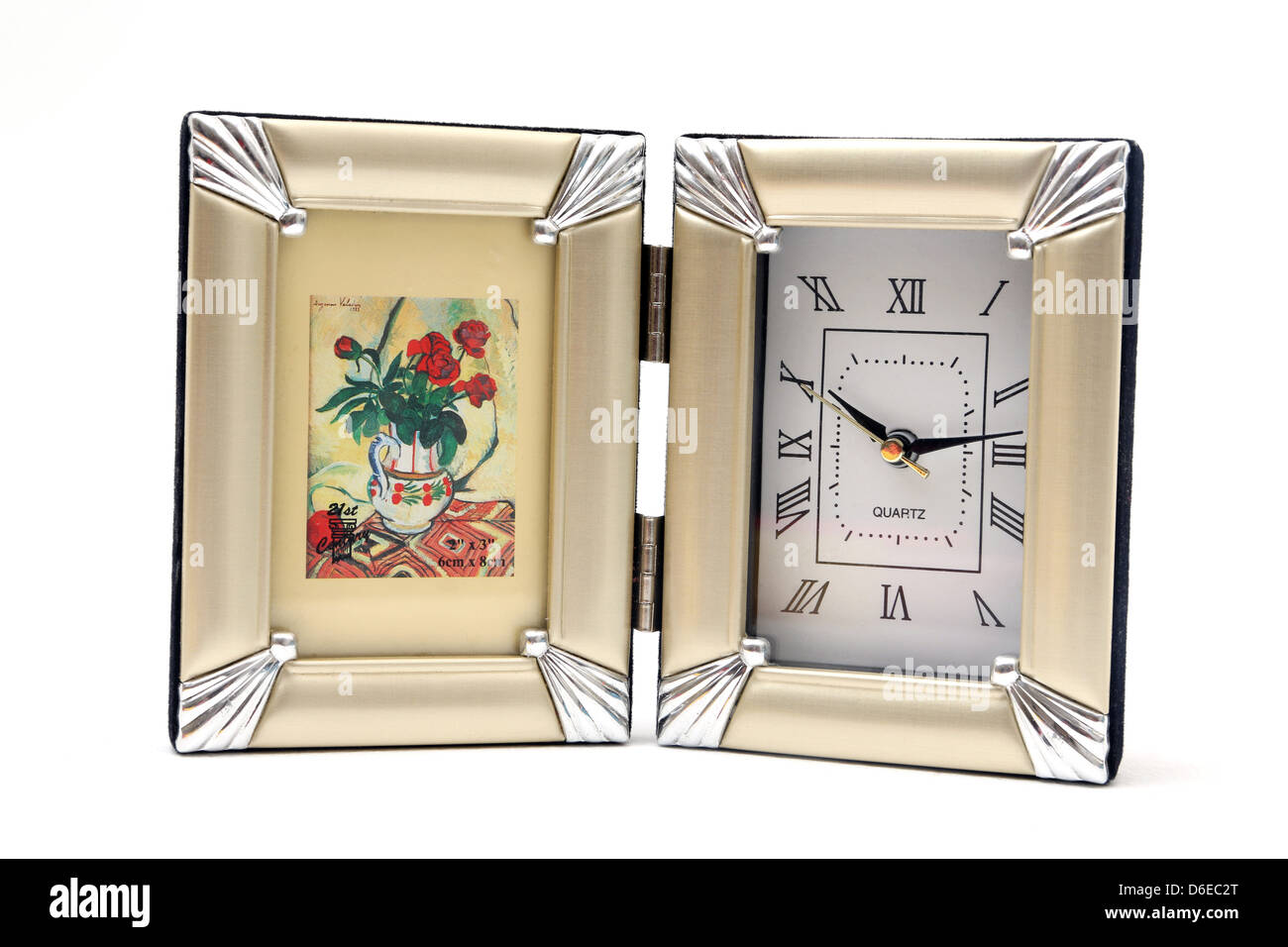 Quarzuhr mit römischen Ziffern und Fotorahmen Stockfoto