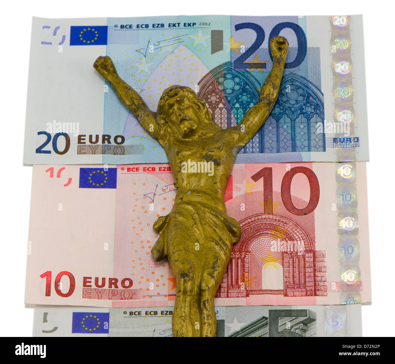 Gold Jesus kreuzigen auf Euro-Bargeld Geld Banknoten isoliert auf weißem Konzept Europa Finanz Krise 05:10 und 20 Euro Bank Stockfoto