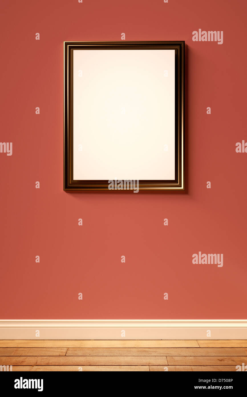Messing-Bilderrahmen auf einer roten Wand in einem leeren Raum Stockfoto