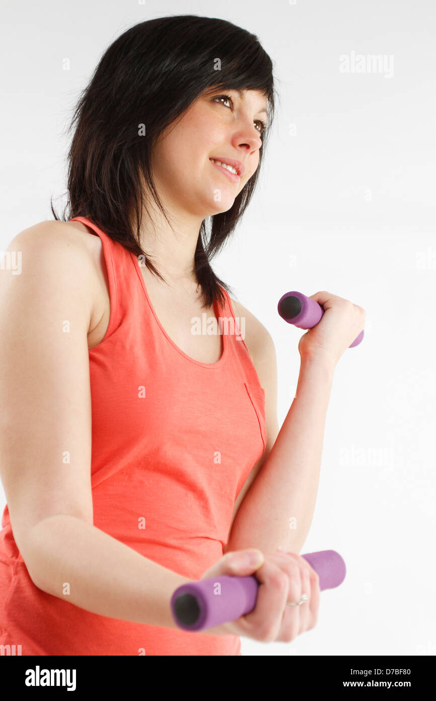 FRAU, DIE AUSÜBUNG EINER SPORTS Stockfoto