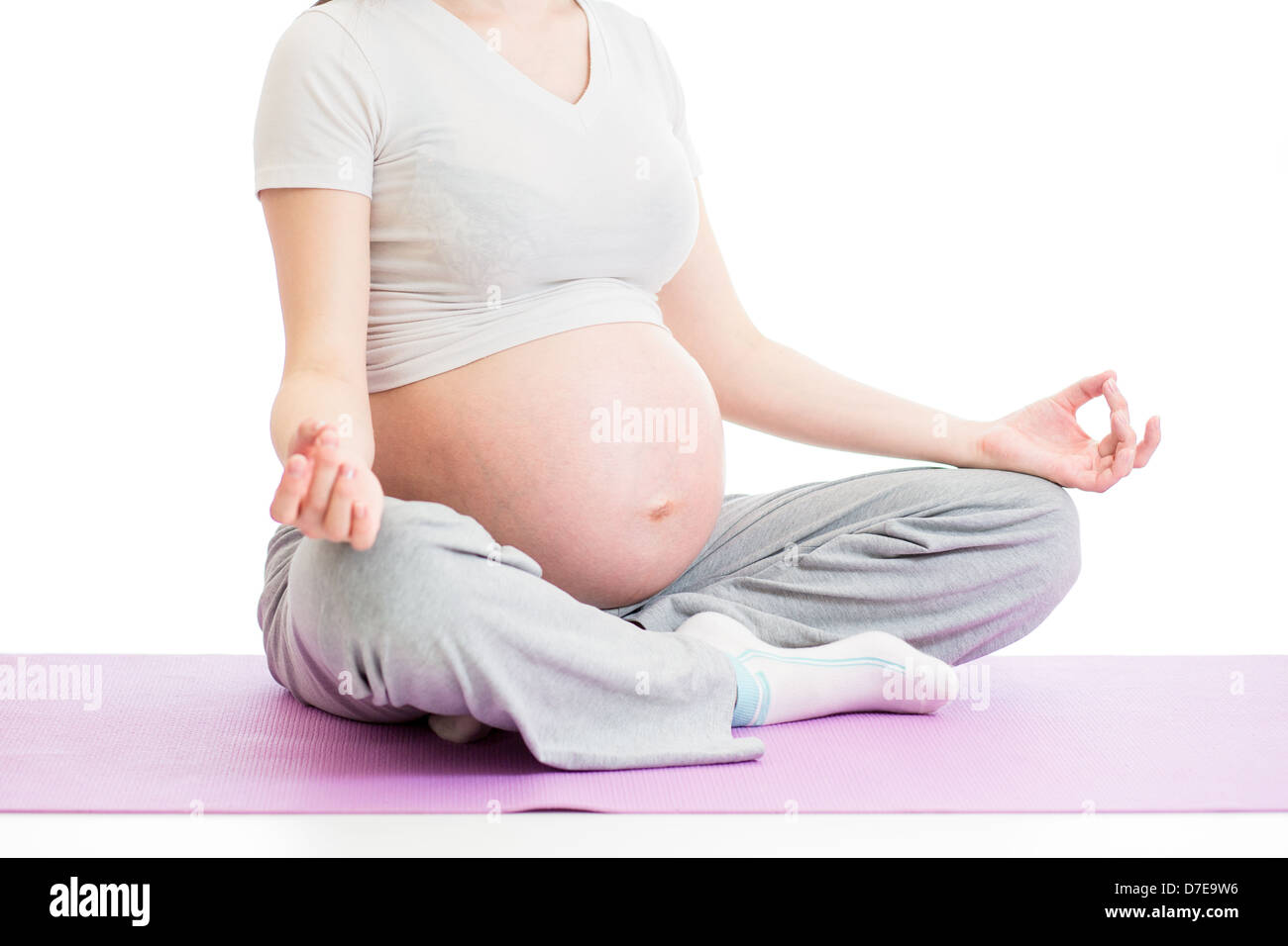 Schwangere Frau sitzen in Yoga Lotus-position Stockfoto