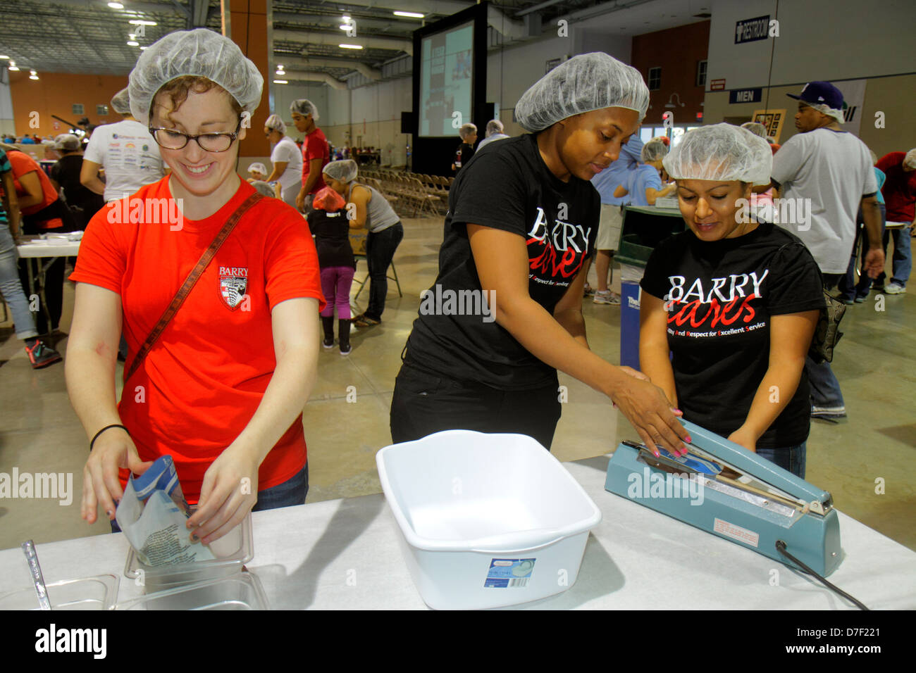 Miami Florida, Miami Dade County Fair und Expo, Feed My Hungving Children, Freiwillige Freiwillige Community Service ehrenamtliche Arbeit Arbeiter, teamwo Stockfoto