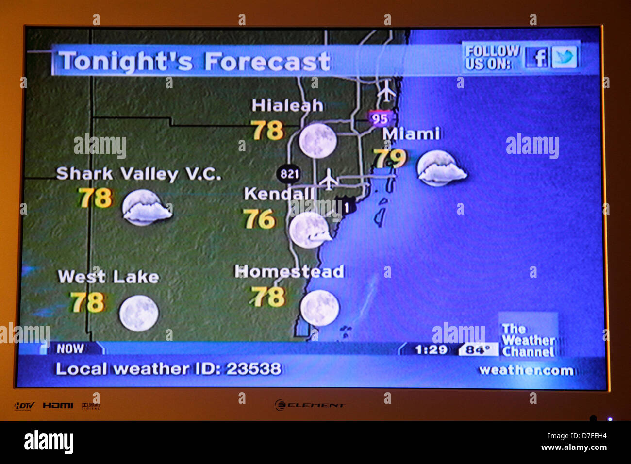 Miami Beach Florida, Fernseher, Set, TV, Flachbildschirm, Monitor, Kabel, der Wetterkanal, Wettervorhersage, Temperaturen, folgen Sie uns auf facebook, Besucher reisen Stockfoto