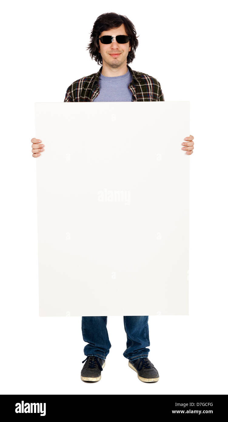 Kaukasischen Mann in seinen frühen 30er Jahren in Freizeitkleidung mit großen leeren weißen Schild anscheinend Blick in die Kamera durch gekleidet Stockfoto