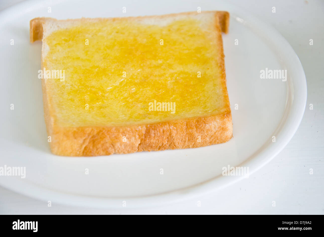 Brot mit Butter zum Frühstück Essen Stockfoto