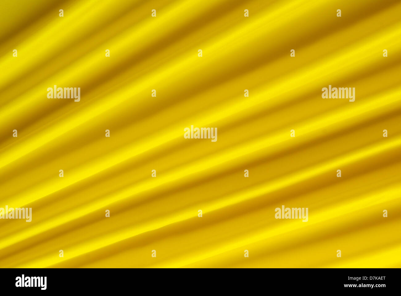 gelb und seidigen Stoff als Hintergrund angeordnet Stockfoto