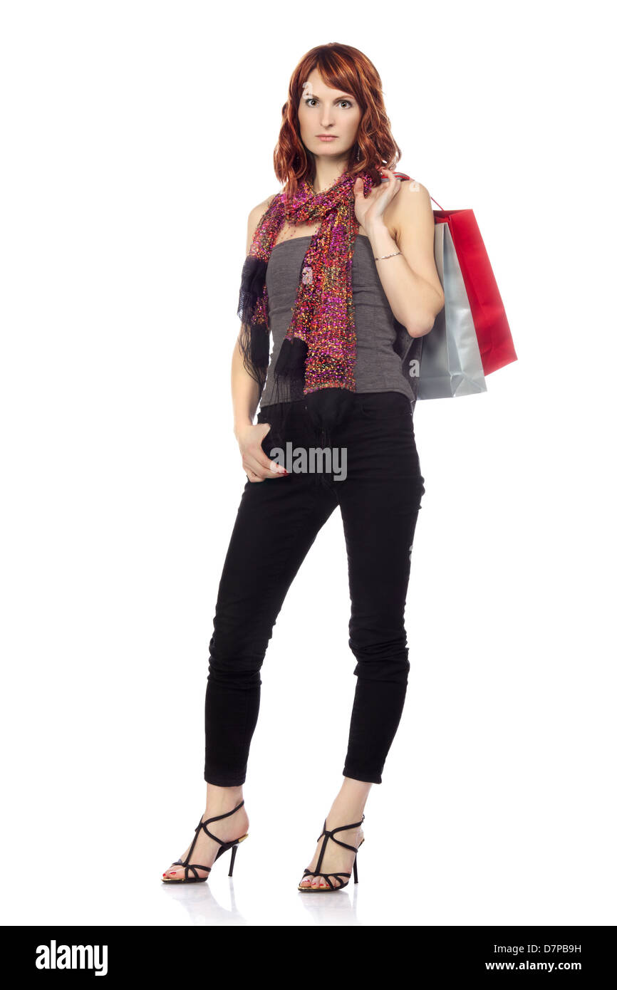 glückliches Mädchen mit Einkaufstüten, isoliert auf weiss Stockfoto
