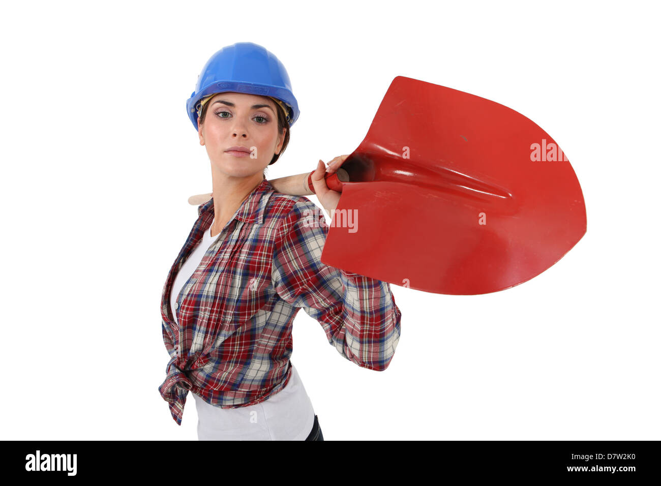 Frau mit Schaufel über die Schulter Stockfoto