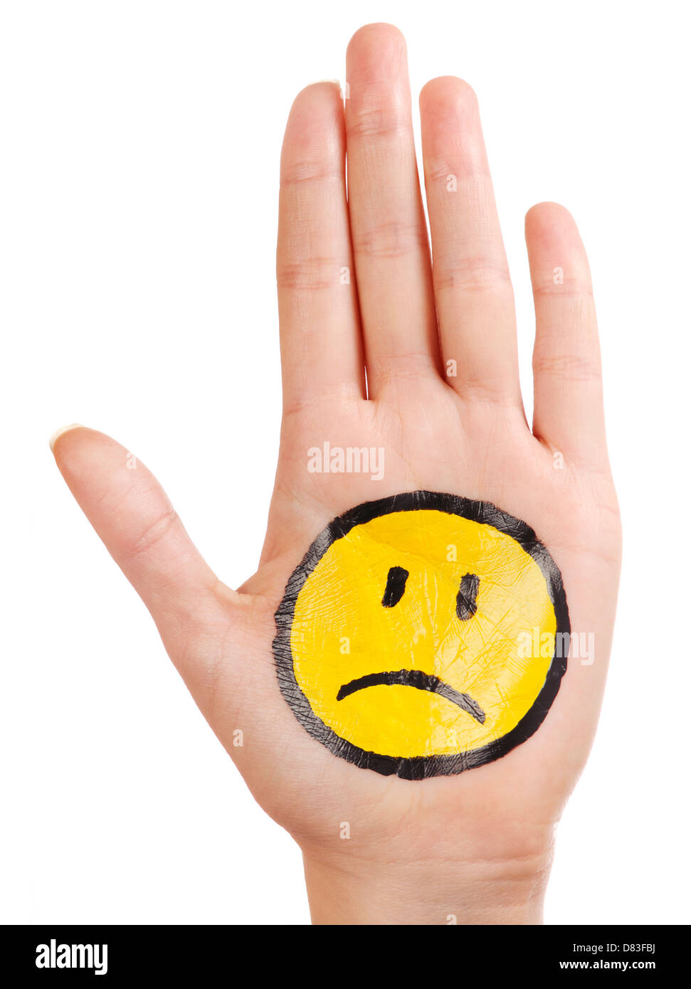 Hand mit einem unglücklich Trauriges Smiley Smiley Emotion Symbol gemalt auf der Handfläche isoliert auf weißem Hintergrund Stockfoto