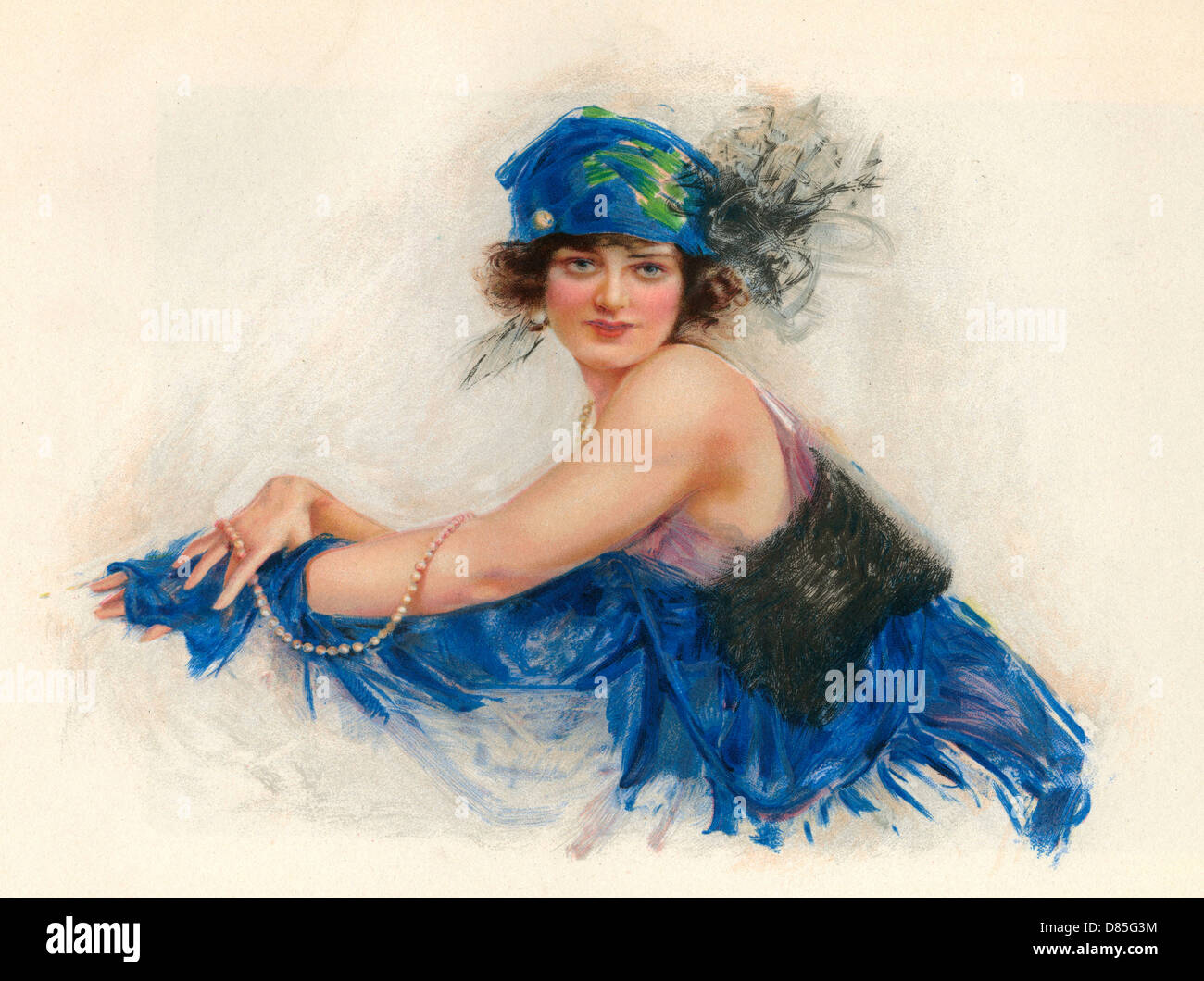 Frau trägt blaues Kopftuch mit Plüschchen 1920er Stockfoto