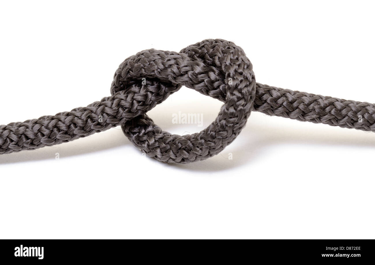 Schwarzen Seil Knoten auf weißem Hintergrund Stockfoto