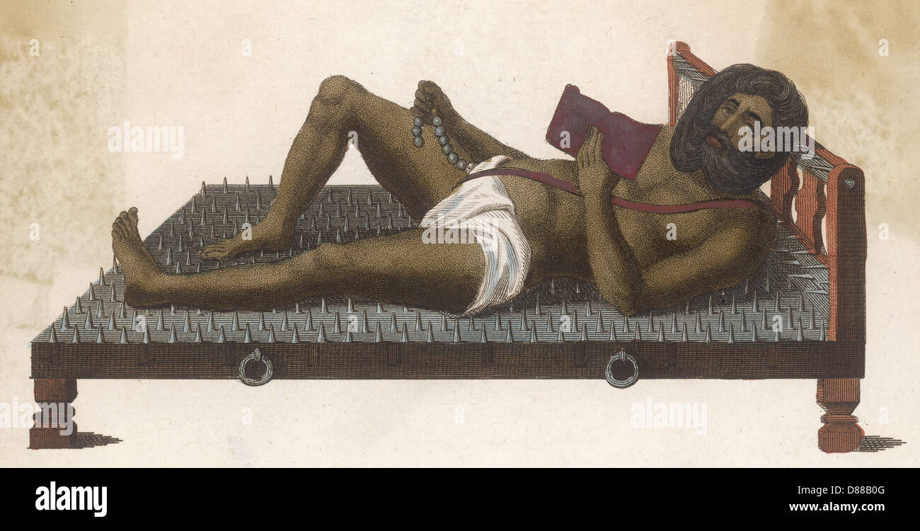 Fakir auf dem Nagelbrett Stockfoto