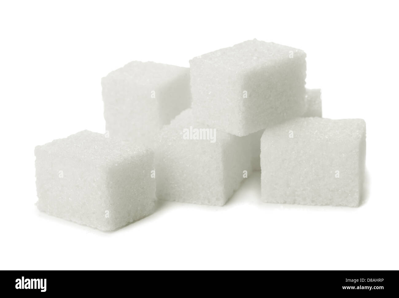 Haufen von Zucker Klumpen isoliert auf weiss Stockfoto