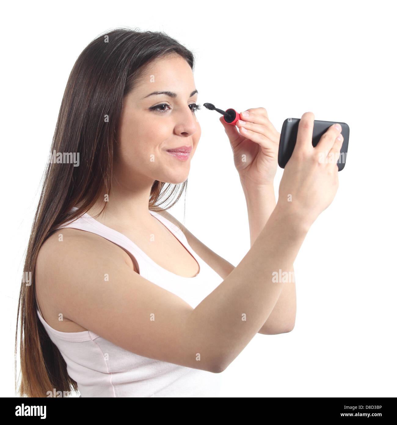 Schöne Teenager-Mädchen machen sich mit ihrem Telefon wie ein Spiegel Stockfoto