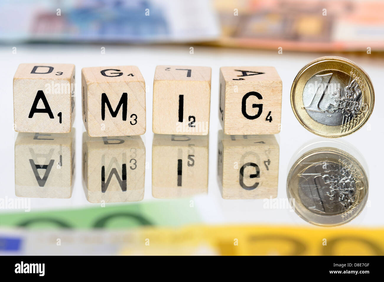 Das Wort Amigo mit Buchstaben und ein-Euro-Münze, Amigo-Affäre Stockfoto
