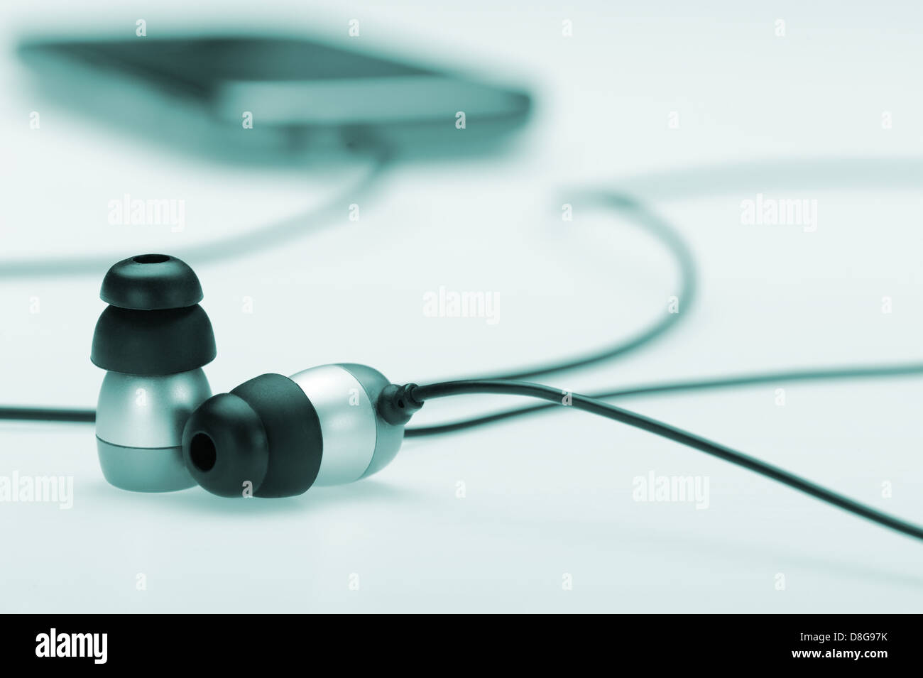 in Ear Kopfhörer mit mobilen audio-player Stockfoto