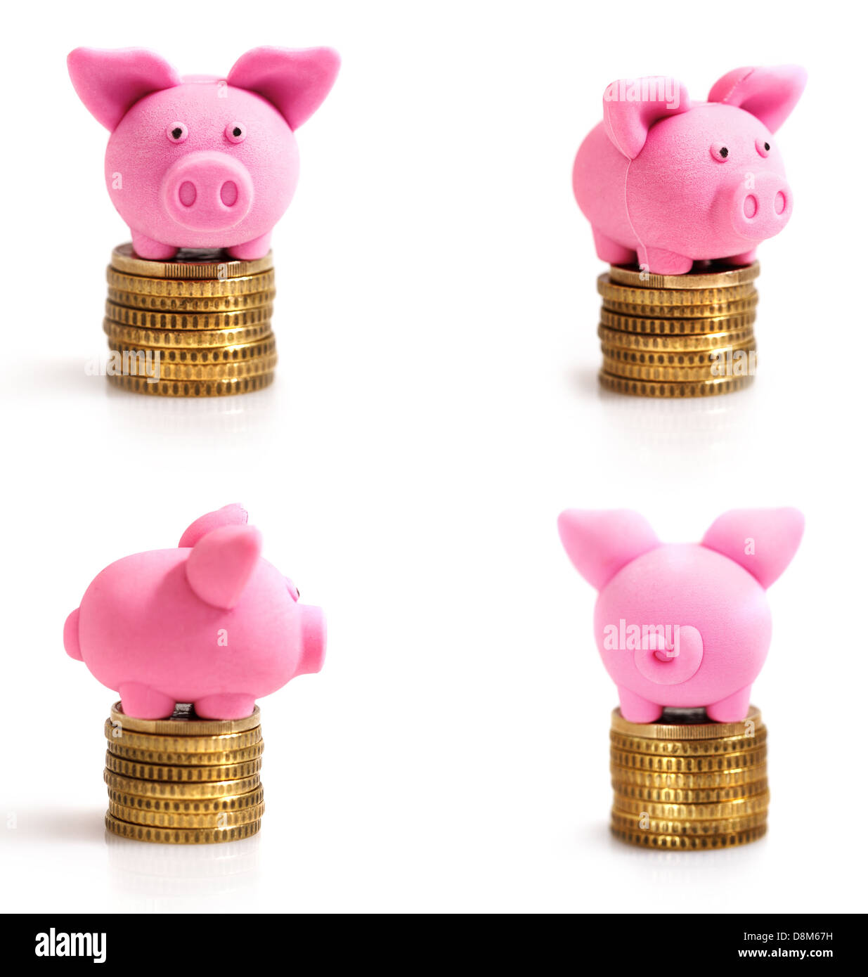 Vier kleine rosa Schweinchen auf Münzen Stockfoto