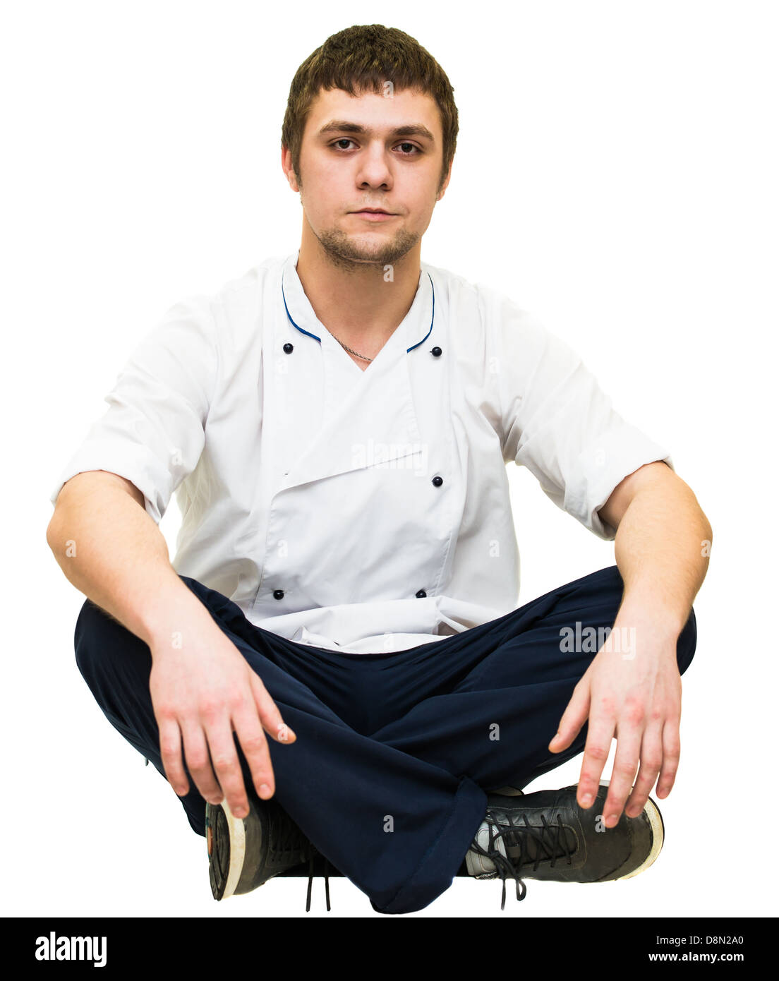 sitzt im Schneidersitz Stockfoto