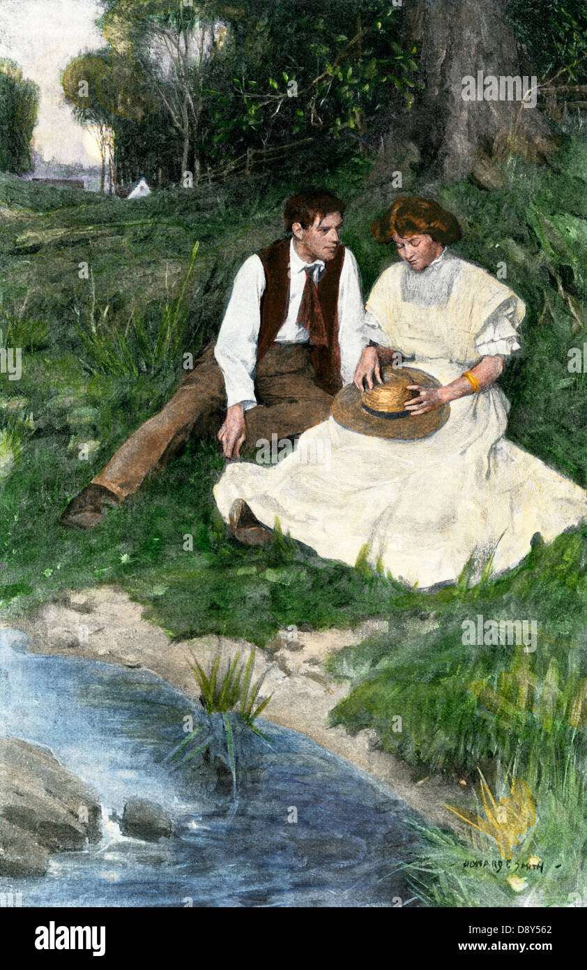 Junges Paar sitzt, die von einem Bach, Anfang 1900. Handcolorierte halftone einer Abbildung Stockfoto