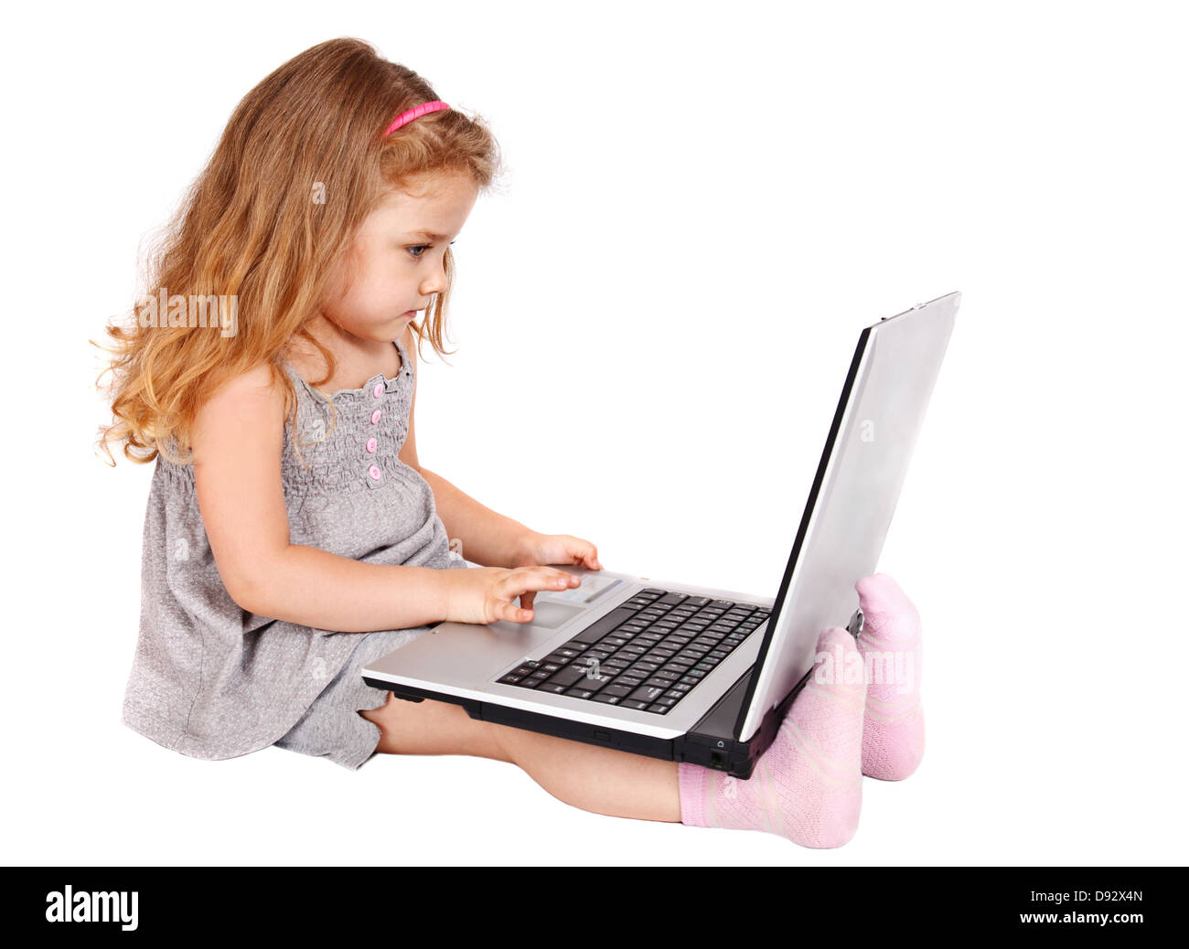 Kleines Mädchen mit laptop Stockfoto