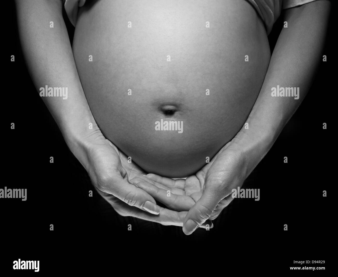 Nahaufnahme der schwangeren Frau Bauch, Studioaufnahme Stockfoto