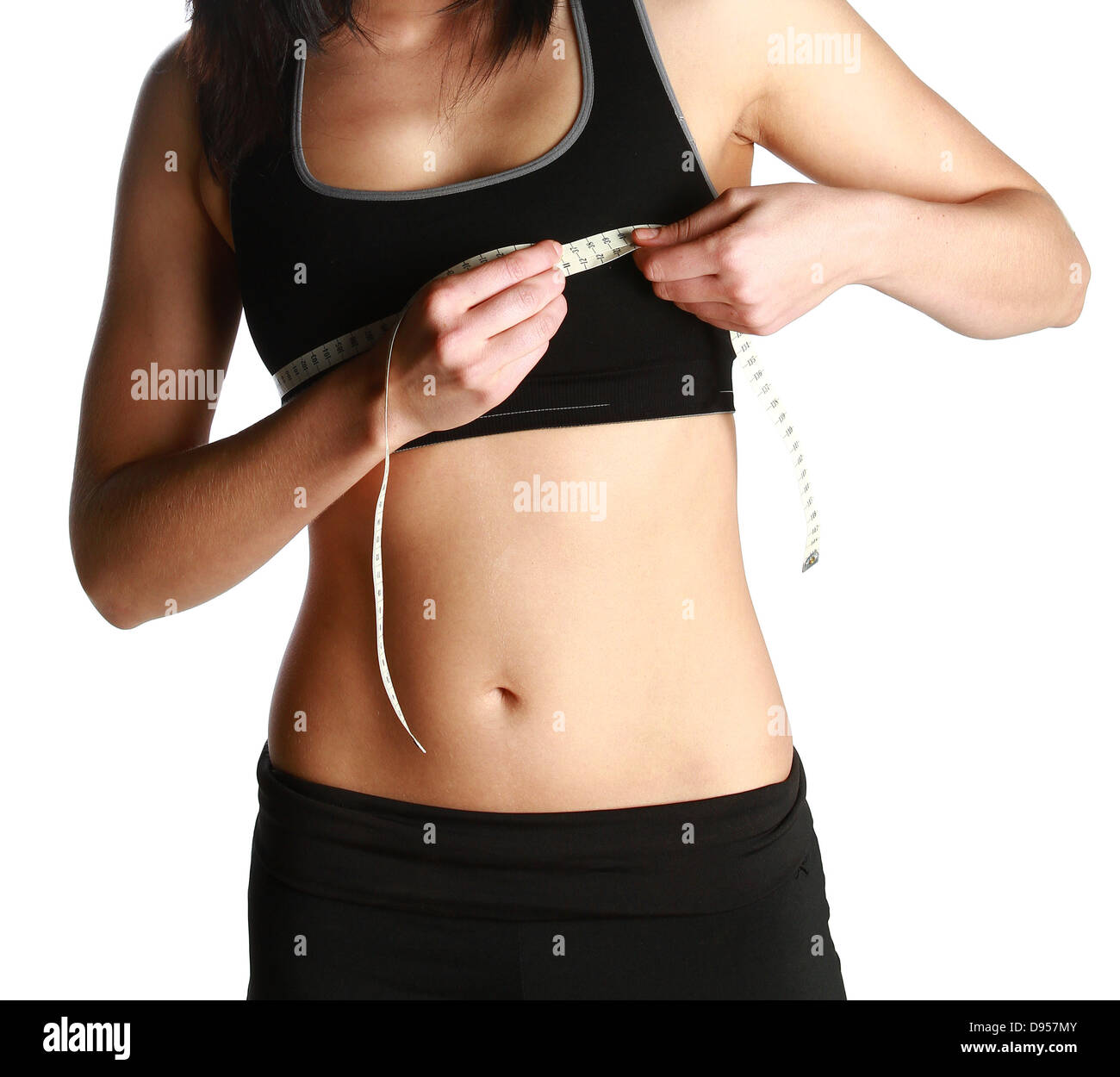 Eine Fitness-Fanatiker ist ihre Brust Linie messen, nach Sport und Diäten. Stockfoto