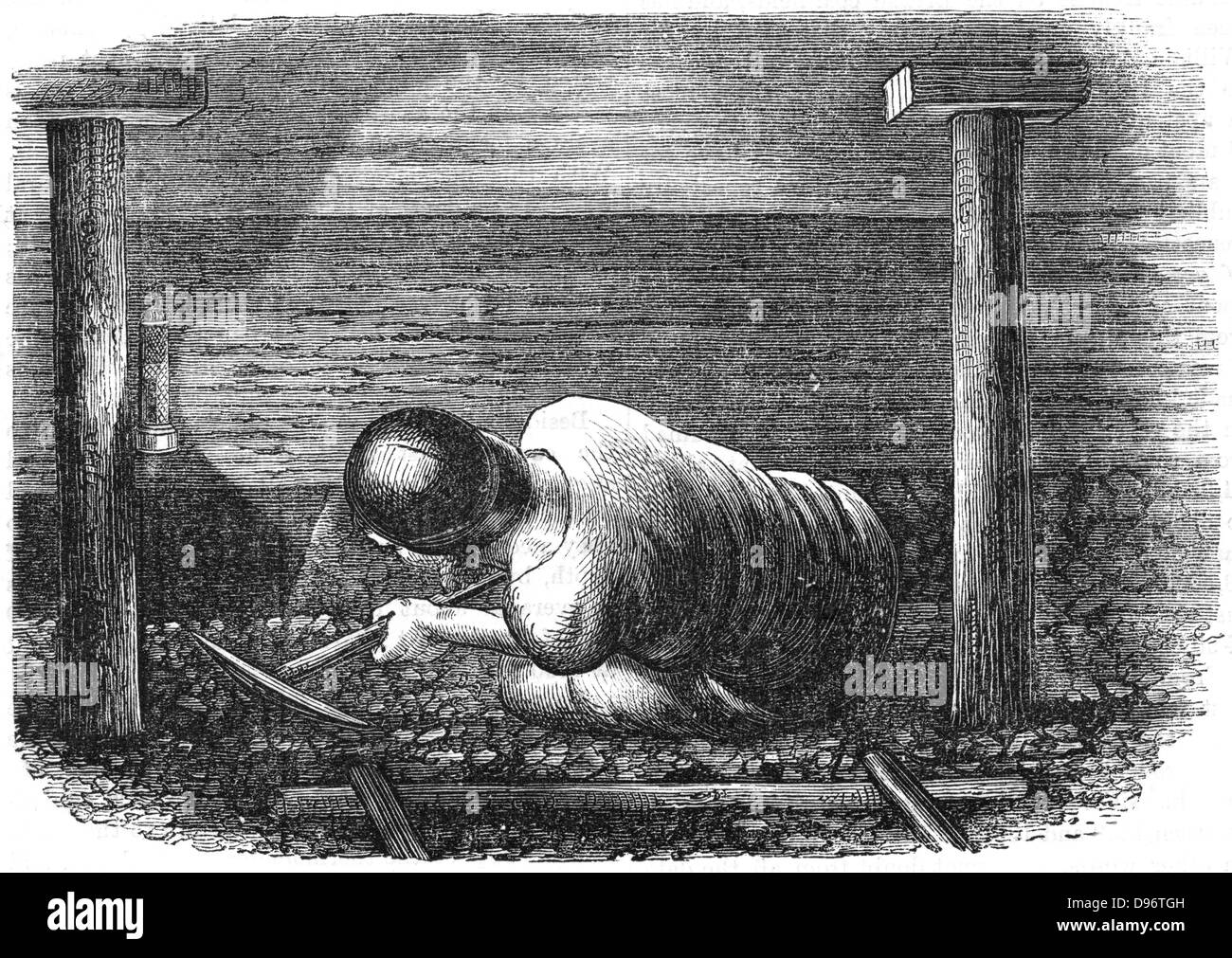 Miner arbeiten eine Naht mit einem Plektrum "Balgerei" aus der Kohle. Grube Requisiten und Sicherheitsleuchte. Holzstich, 1864 Stockfoto