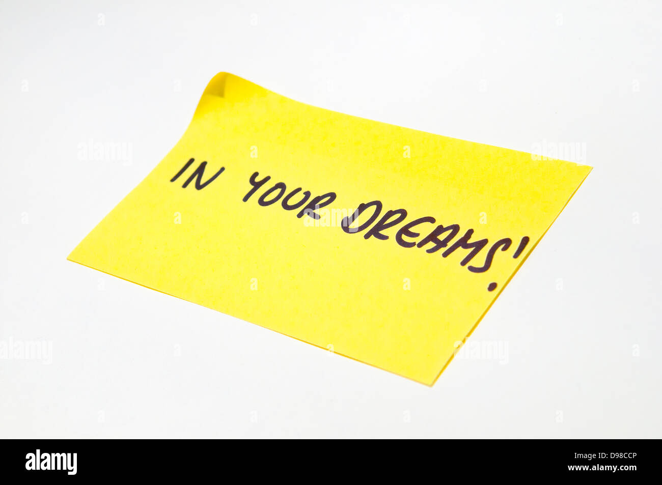"In Your Dreams" geschrieben auf einem gelben post-it note Stockfoto