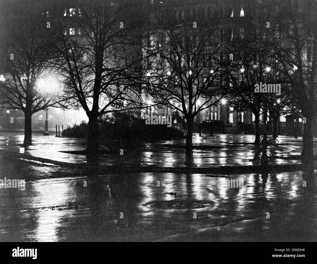 New York City Street in einer nassen Winternacht von Gas-Straßenbeleuchtung, c1885 beleuchtet. Stockfoto