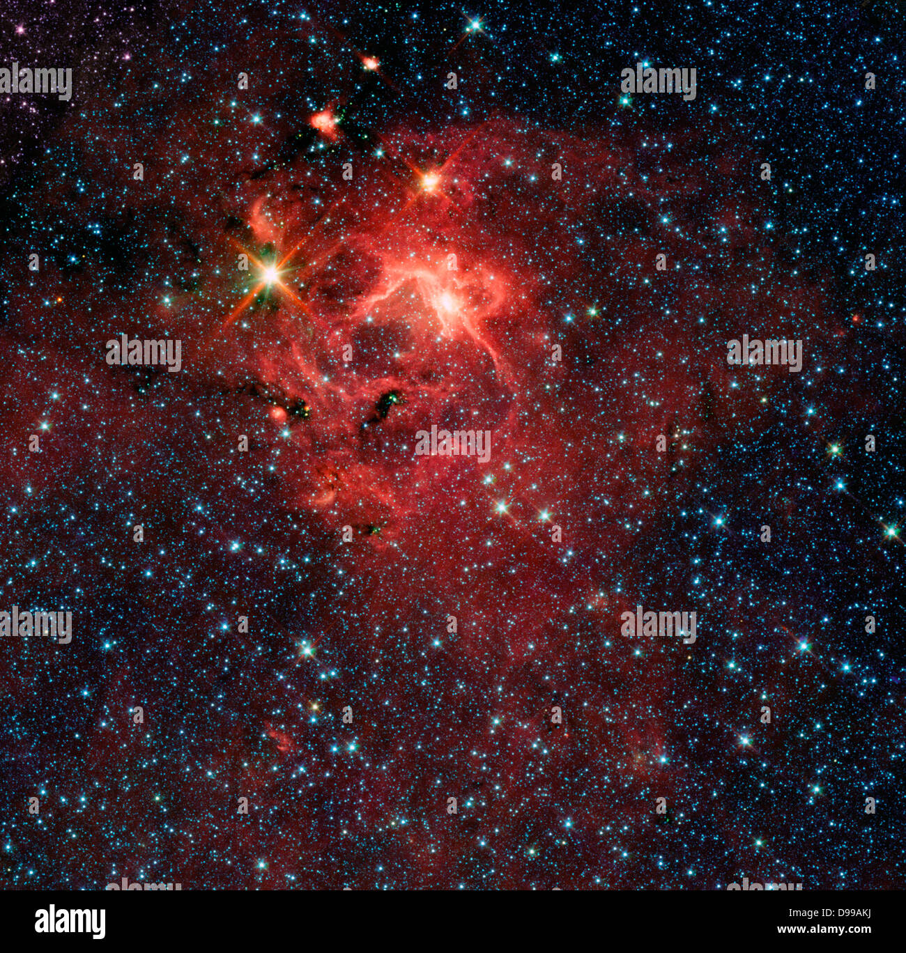 Diese sternentstehungsregion, von NASA's Spitzer Space Telescope erfasst, wird durch die hellen, jungen Stern IRAS 13481-6124 (oben links), das etwa 20-fache Masse unserer Sonne und fünf Mal seinen Radius und ist umgeben von seinen pre-natal Cocoon dominiert. Stockfoto