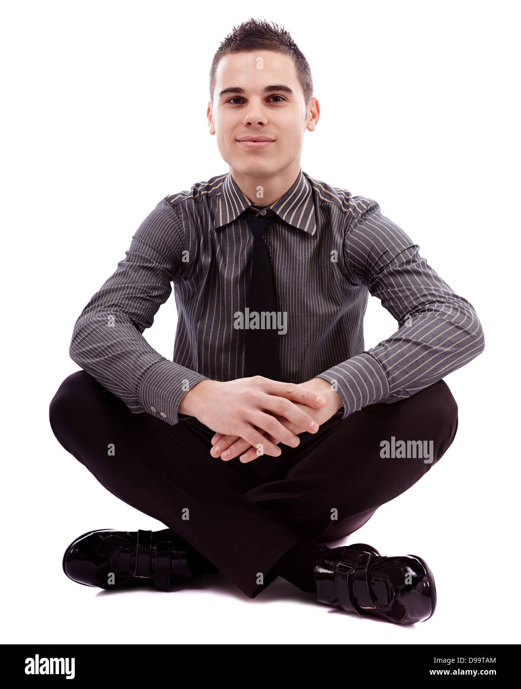 Voller Länge Pose der erfolgreiche Geschäftsmann Schneidersitz auf dem Boden sitzend isoliert auf weißem Hintergrund Stockfoto