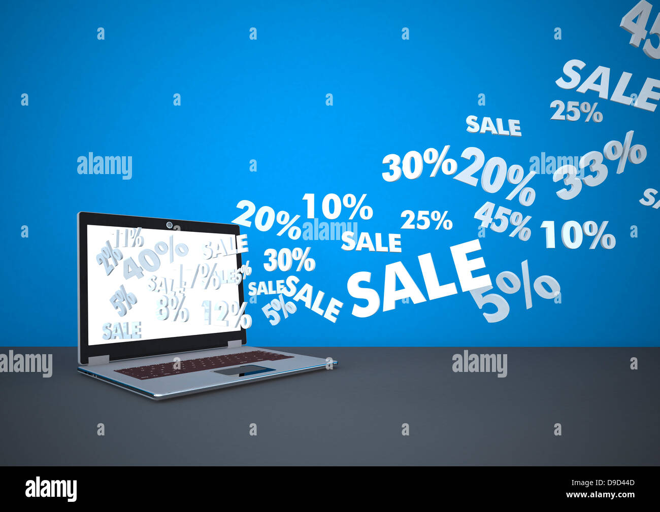 Laptop vor blauem Hintergrund Stockfoto