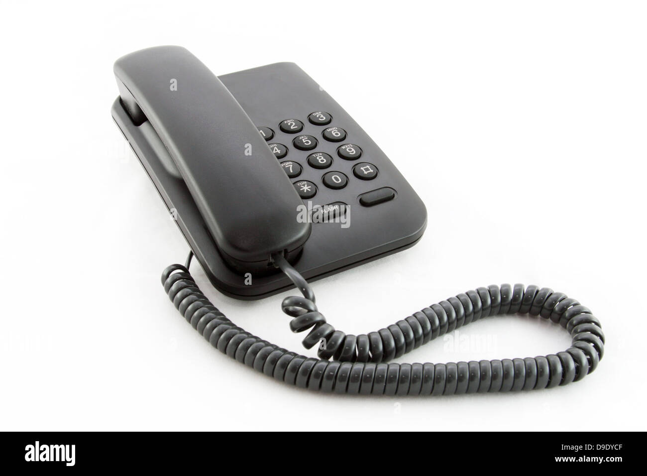 Schwarzer Büro Telefon auf weißem Hintergrund Stockfoto