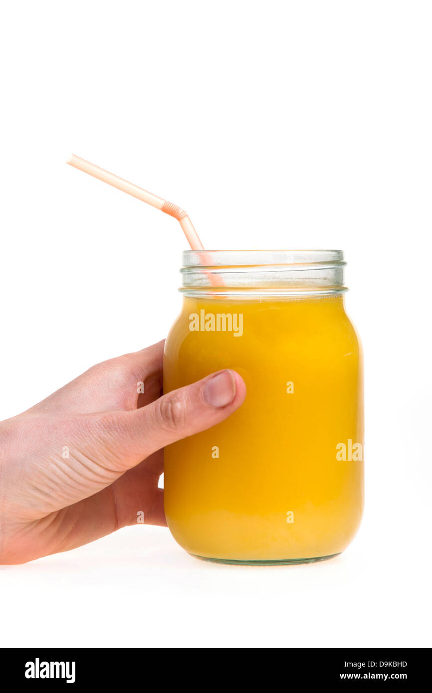 frisch gepresster Orangensaft in ein Marmeladenglas Stockfoto