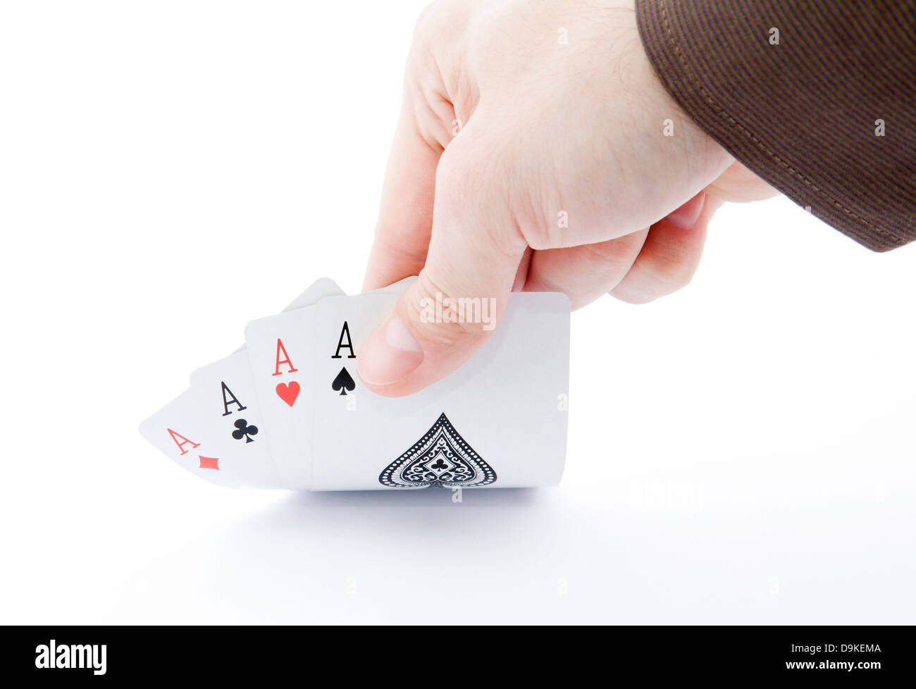 Spielerhand enthüllt vier Asse Stockfoto