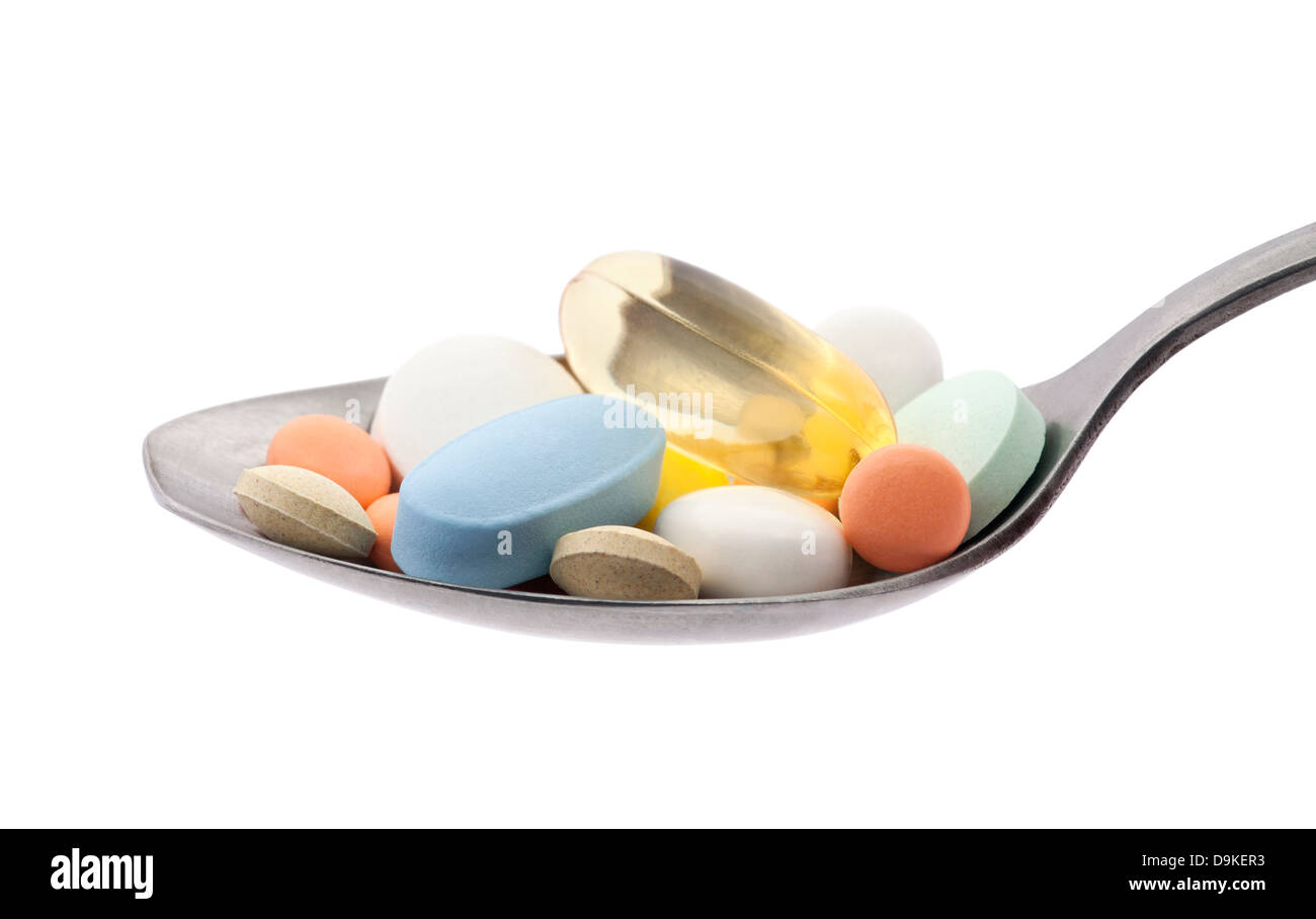 Pillen auf Löffel mit Beschneidungspfad Stockfoto