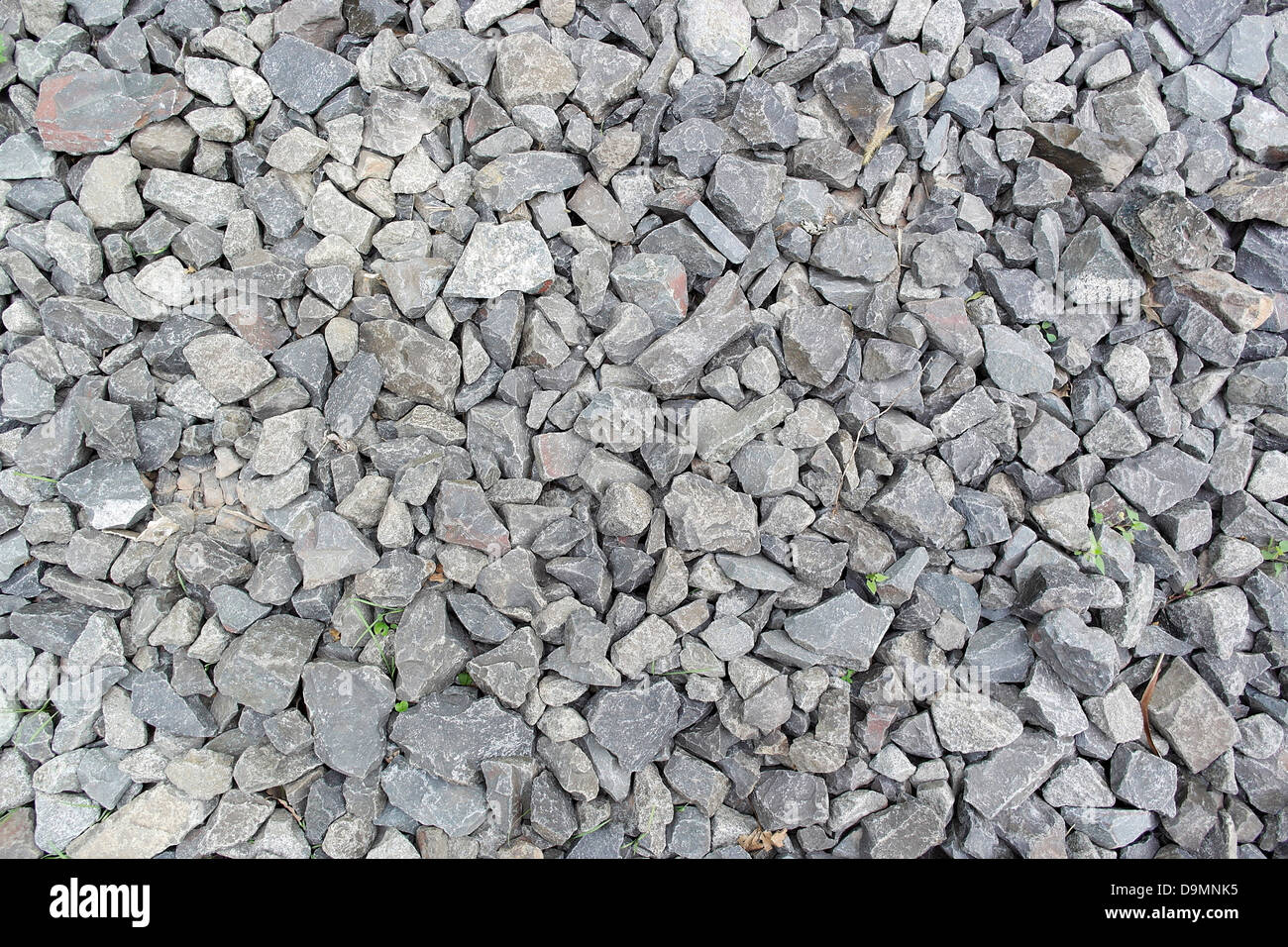 Graue grobe Textur aus zerkleinerten Granit, unwirtlichen aber saubere Oberfläche für Einfahrt Entwässerung Medium. Stockfoto
