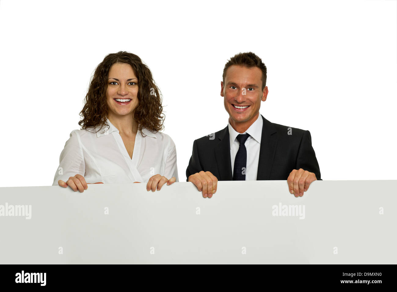 (Model Release) Erfolgreiches Team mit Werbeplakat Stockfoto