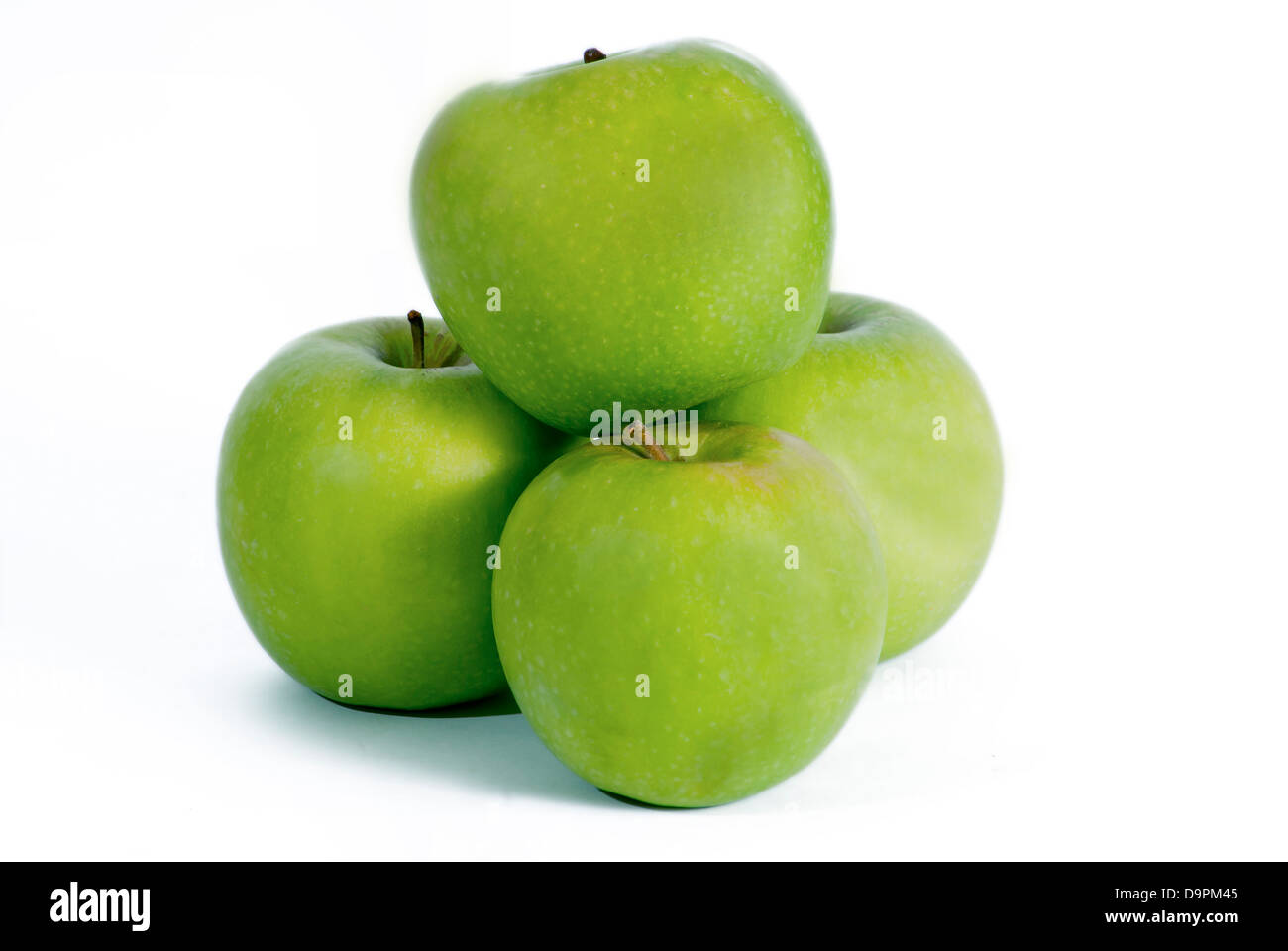 Vier Äpfel auf weiß Stockfoto