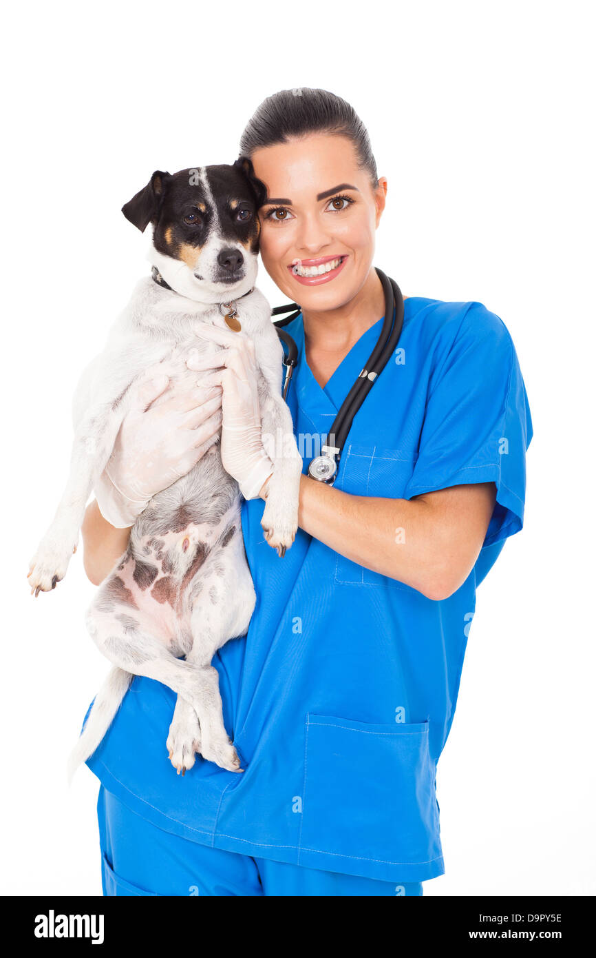 junge weibliche Tierarzt hält einen Hund isoliert auf weißem Hintergrund Stockfoto