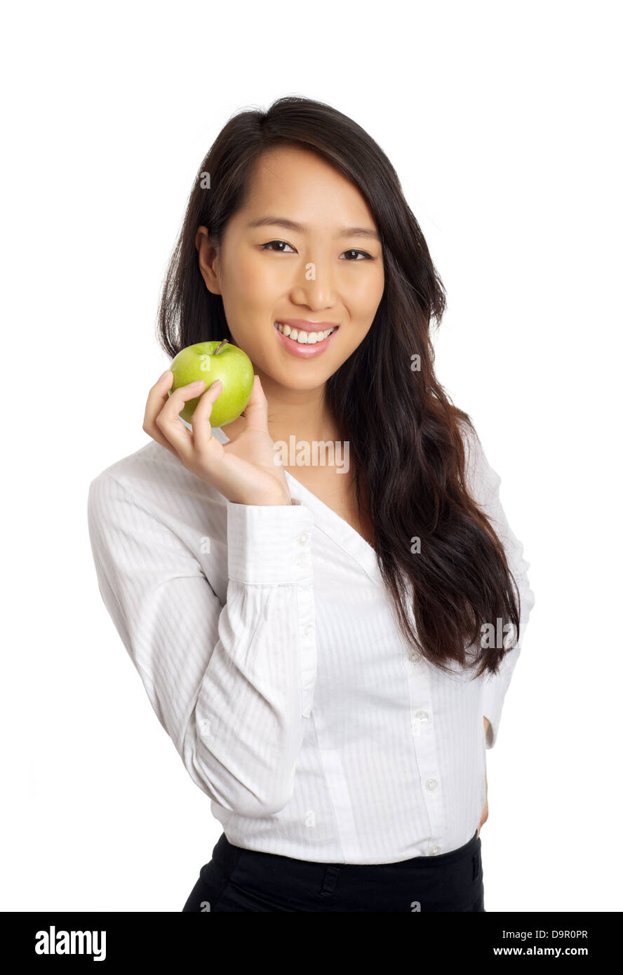 Formale Asian Business-Frau mit grünem Apfel Stockfoto