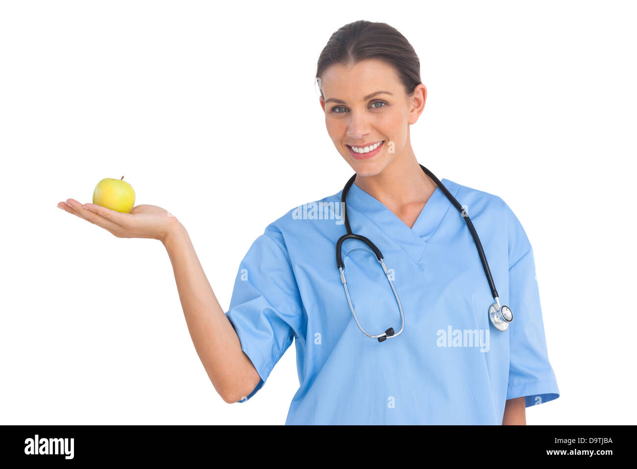 Glücklich Chirurg hält einen Apfel Stockfoto