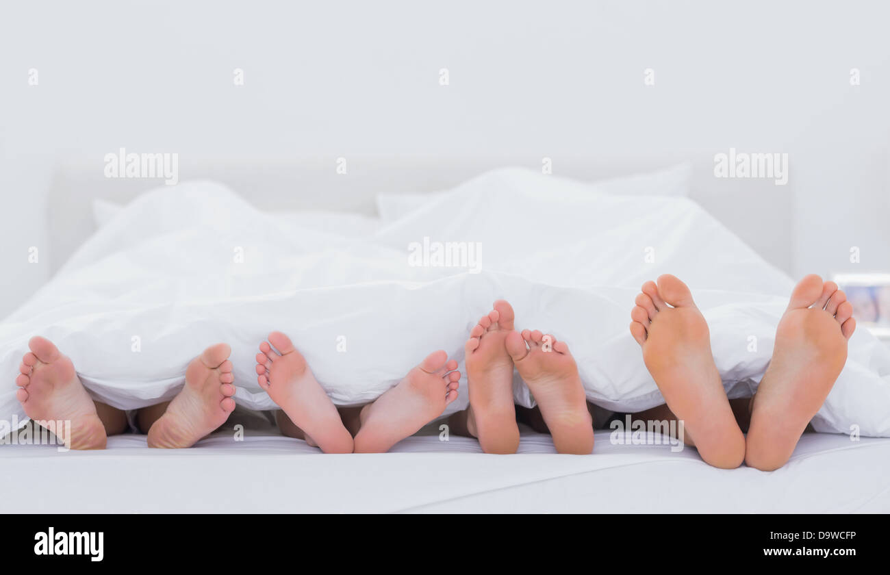 Familie zeigen ihre Füße Stockfoto