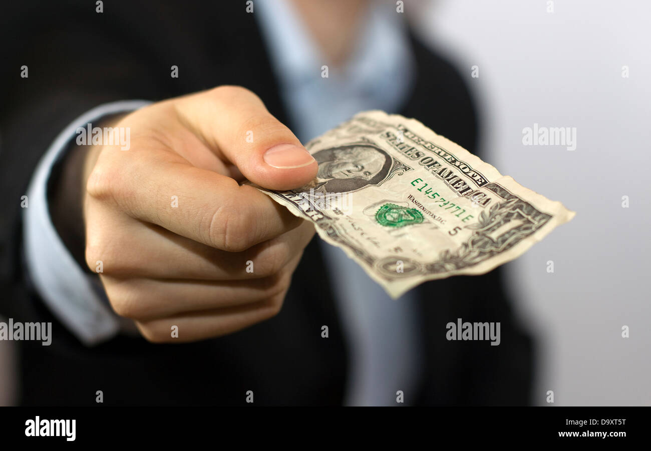 Ein Dollar-Schein in der hand Stockfoto