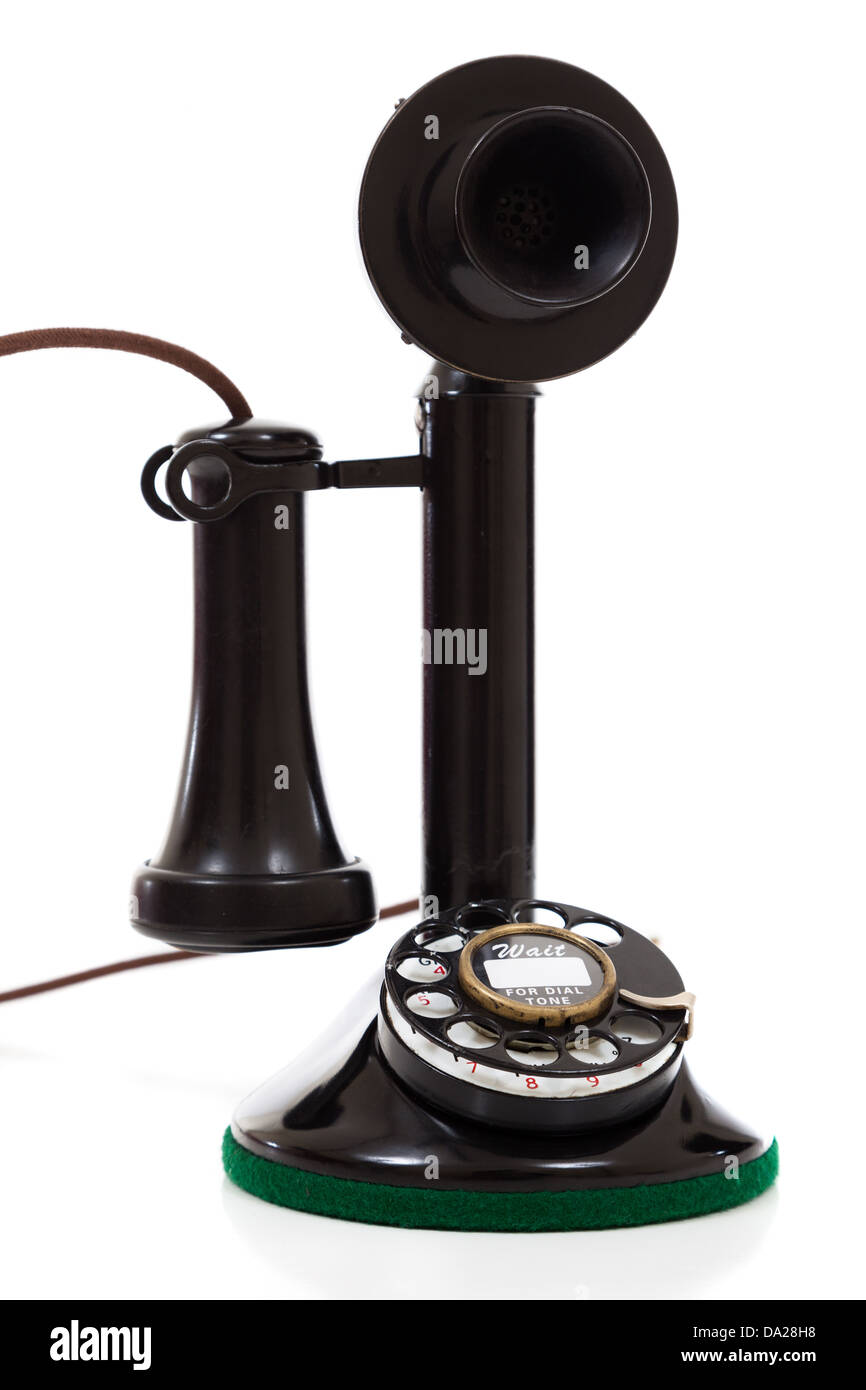 Eine schwarze Kerze Vintage Telefon auf weißem Hintergrund Stockfoto