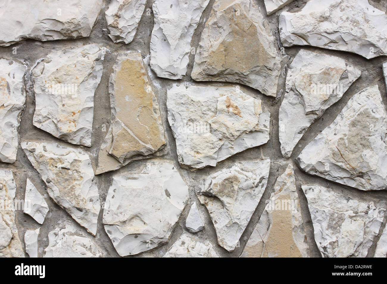 Dies ist eine Wand aus Steinen, wie einige steinerne Hintergrund. Stockfoto