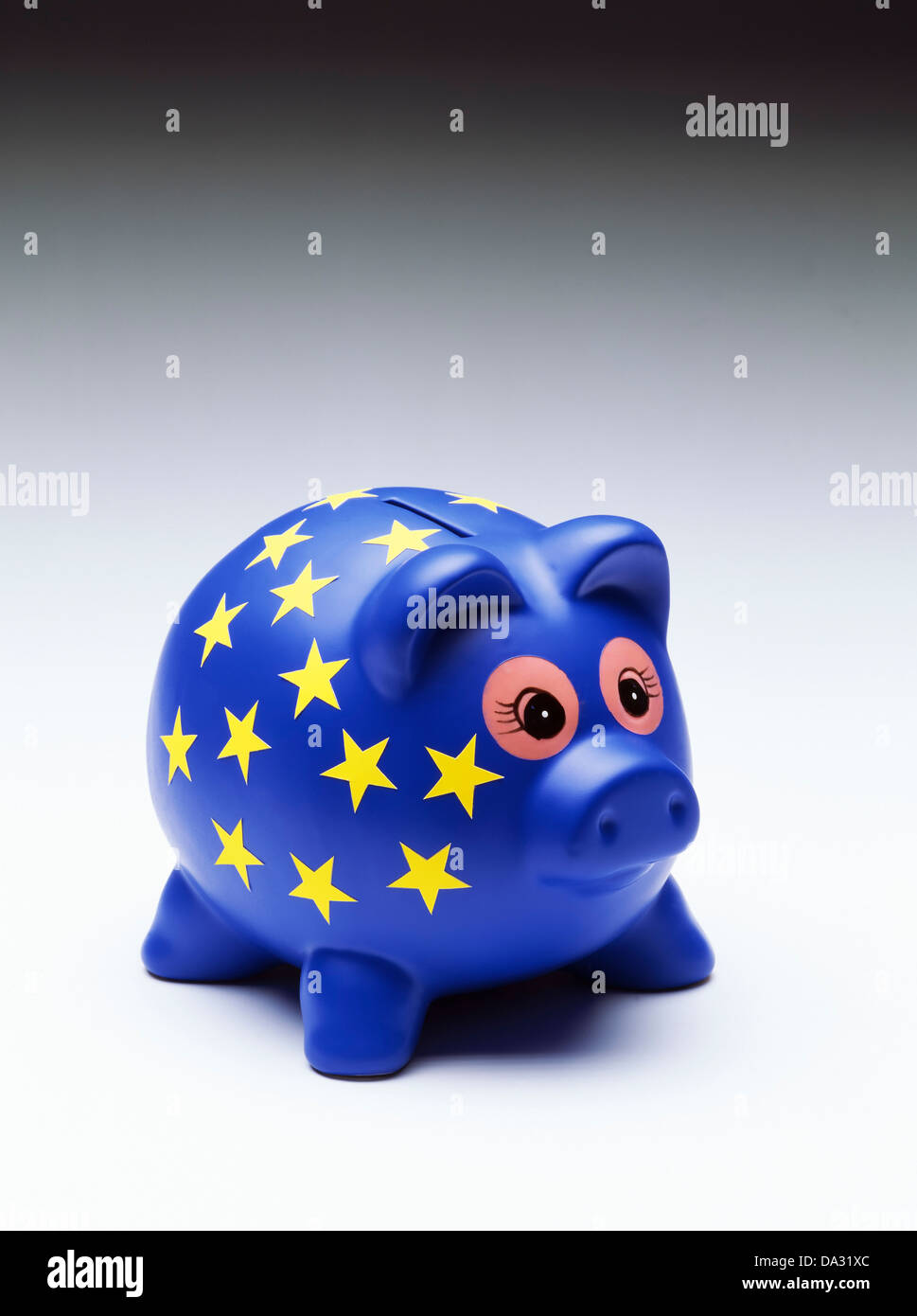 Blaues Sparschwein mit European stars Stockfoto