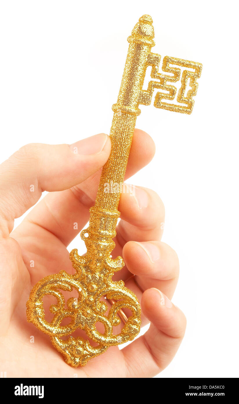 Goldener Schlüssel in Händen der person Stockfoto